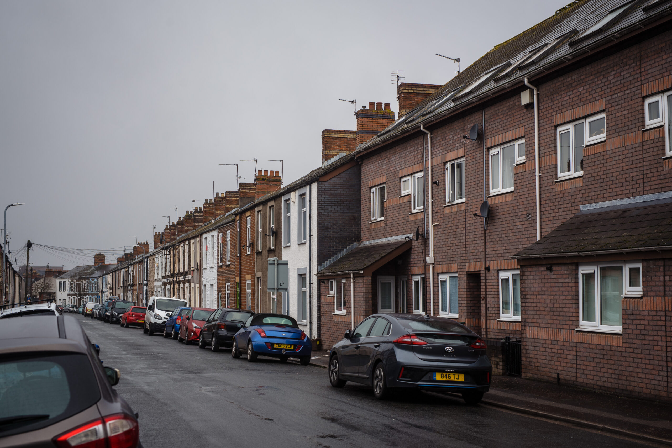 Helen White shares her concerns about the closing of temporary accommodation for Afghan refugees in Wales. Picture of houses in Cardiff by Polly Thomas