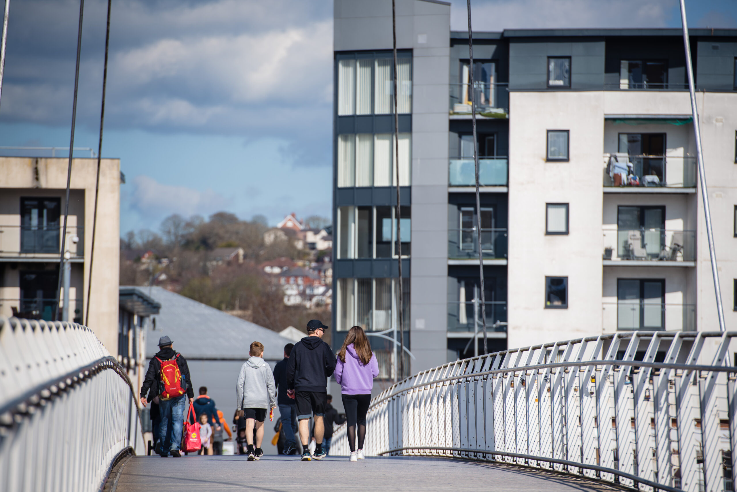 Picture by Polly Thomas - Darren Hughes argues we need a national conversation on the NHS. The picture features people walking on the Footbridge in Newport.