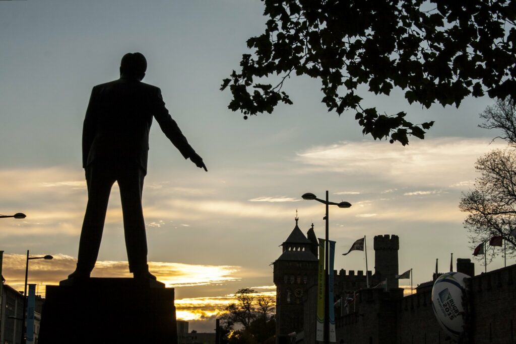 The statue of Aneurin Bevan pointing its finger at Cardiff Castle.