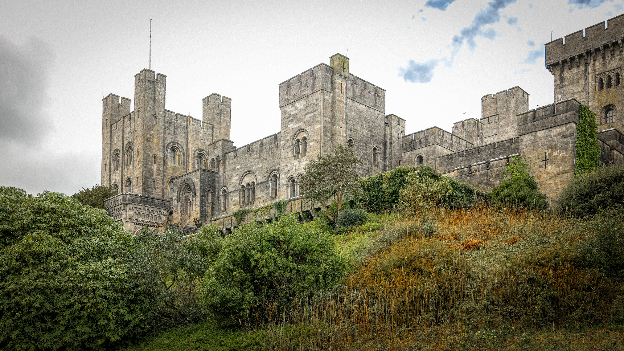 Climate change is already having an impact on the landscape and heritage of Wales, writes Jonathan Hughes of National Trust Cymru. The picture shows Penrhyn Castle, Llandygai, Bangor, Gwynedd, North Wales against a grey sky.