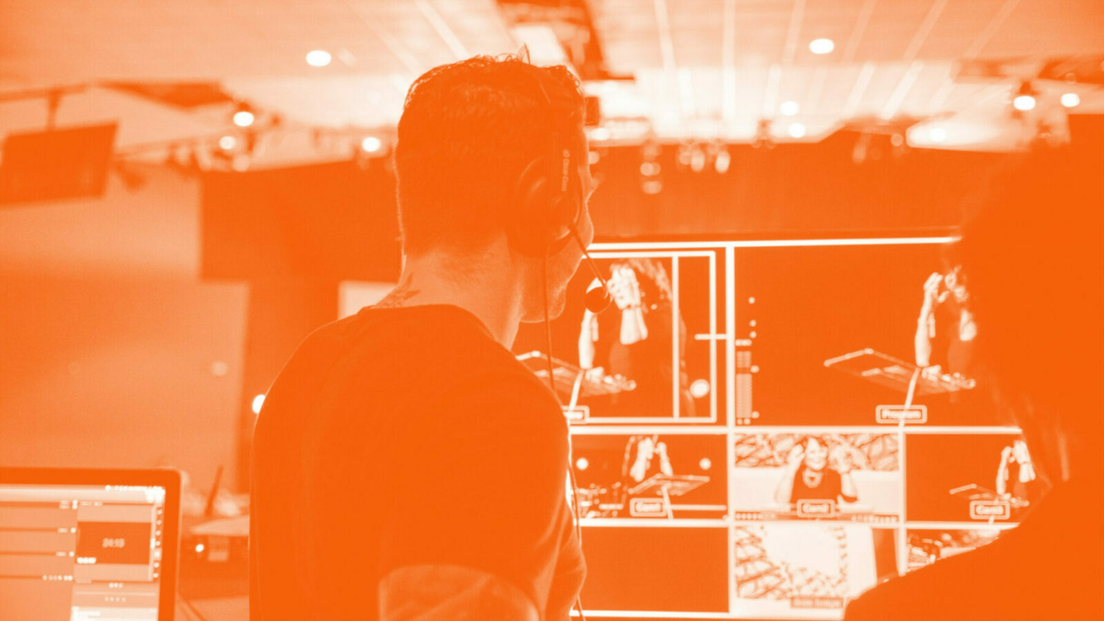 The IWA's media and democracy lead Dylan Moore launches a new project on Welsh media, which will be looking at all dimensions of Wales' creative economy. Pictured is a TV producer looking at several monitors.