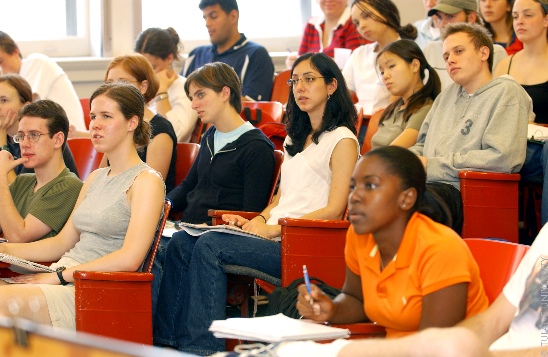 Students in a classroom. The picture is used to illustrate the idea of lifelong education to global citizenship.