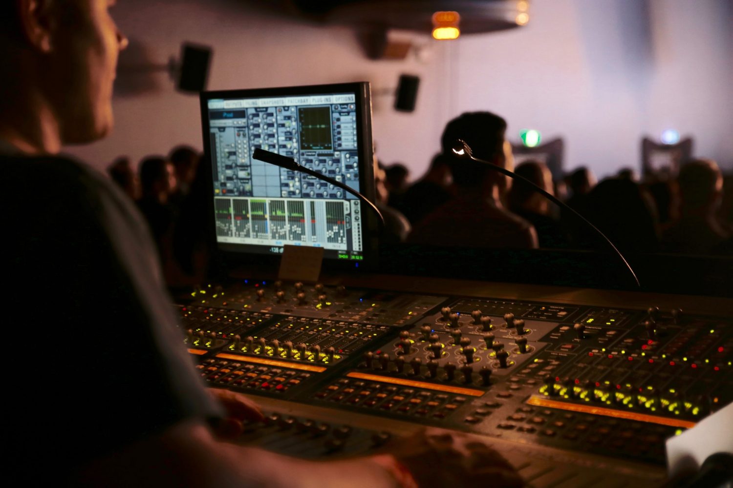 Man in front of a mixing console.