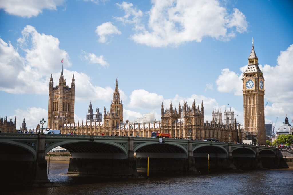 A picture of the UK Parliament under a blue sky. This images is used to illustrate an article about parliamentary sovereignty.