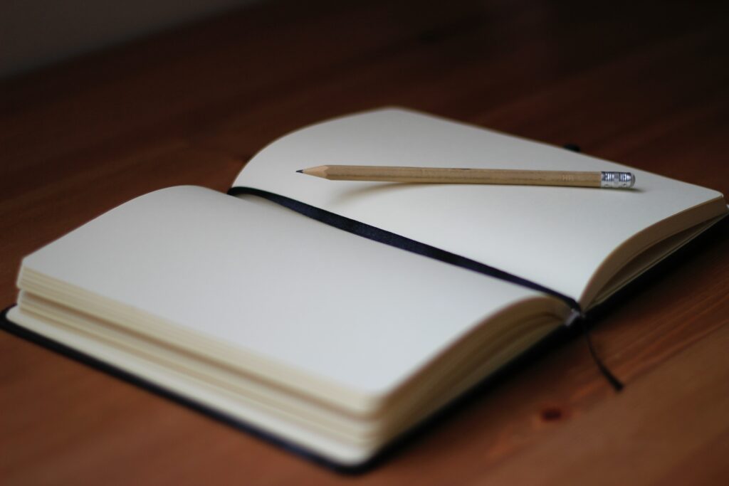 A notebook and a pencil