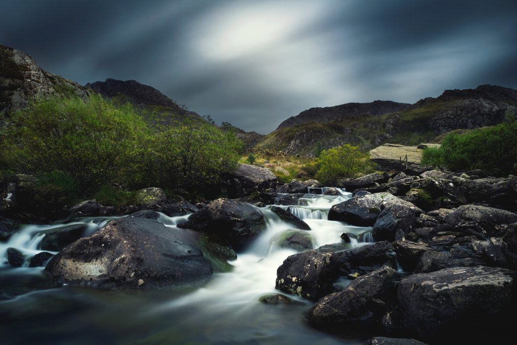 A time-lapse picture of a stream in the Welsh mountains. Photo by Kirk Schwarz on Unsplash.