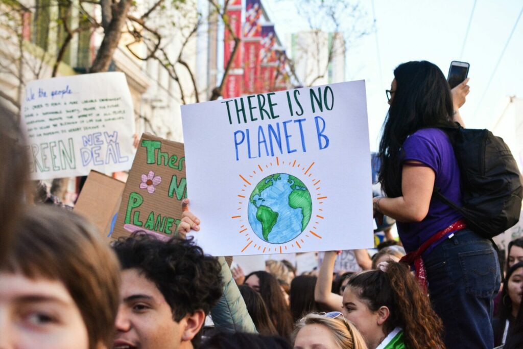 A picture of a protest against climate change. Collective action can be a powerful tool against eco-anxiety, according to Rebecca Solnit.